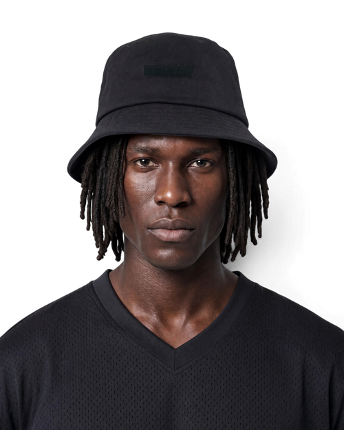 Black satin lined bucket hat by Patt3rn Up LDN helping to reduce hair breakage, prevent frizz and retain moisture for curly, coily and textured hair.